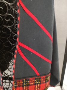 The use of the wave stitch finishes the jacket expertly.
